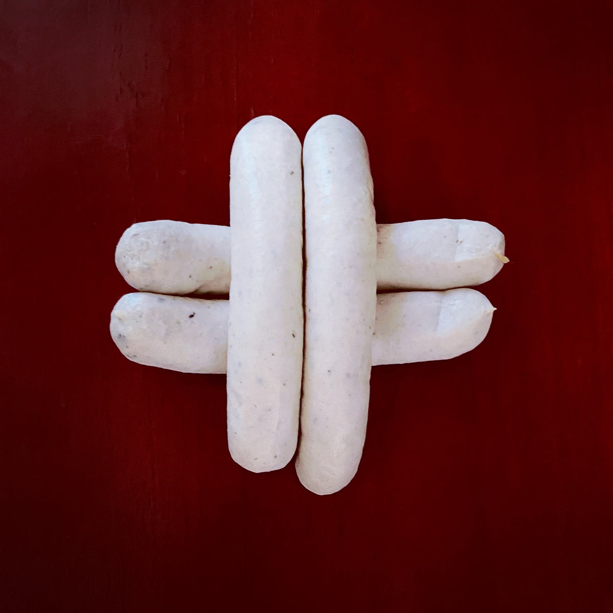 Saucisses de veau artisanales au lait frais et Tuber uncinatum.